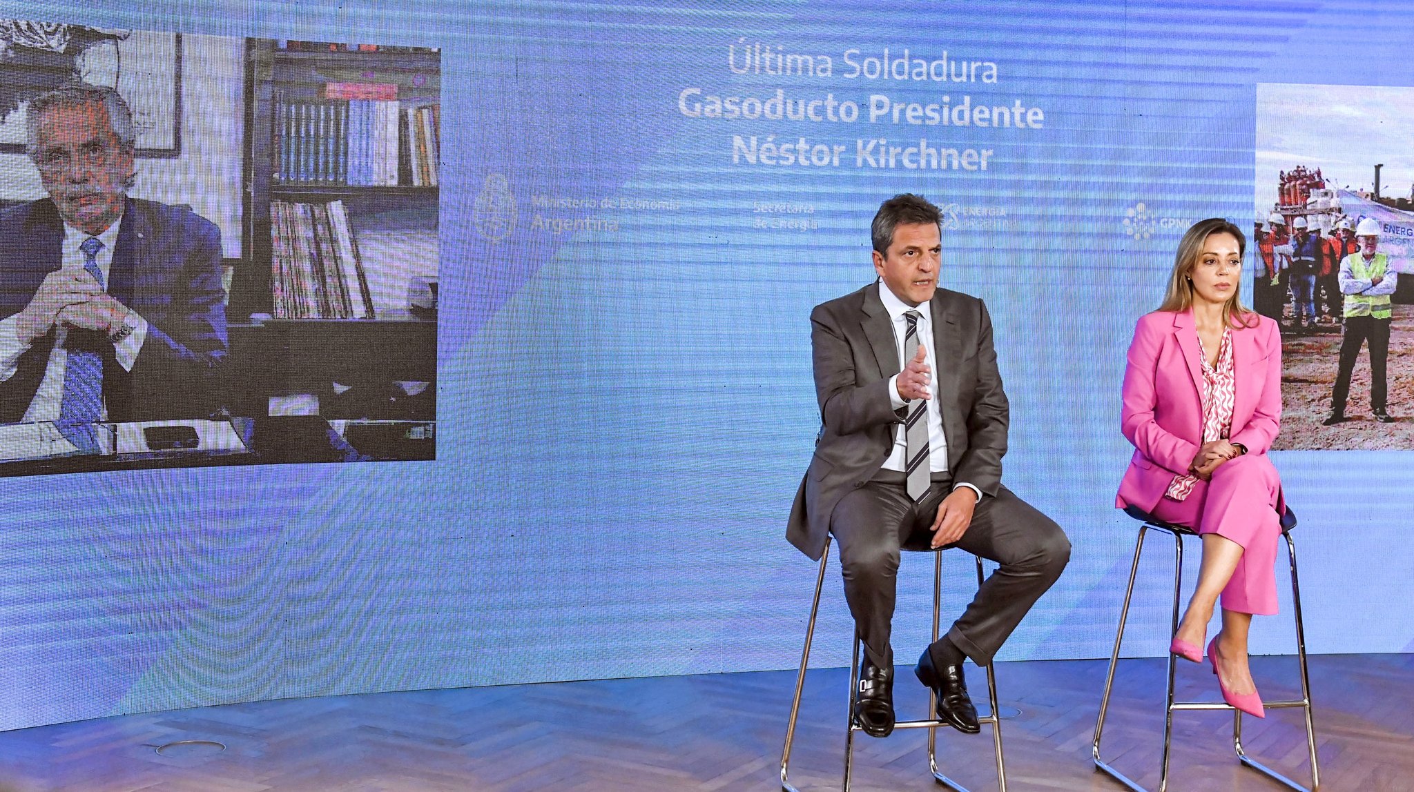 Sergio Massa and the country’s energy secretary Flavia Royón talk with Argentina’s president Alberto Fernández