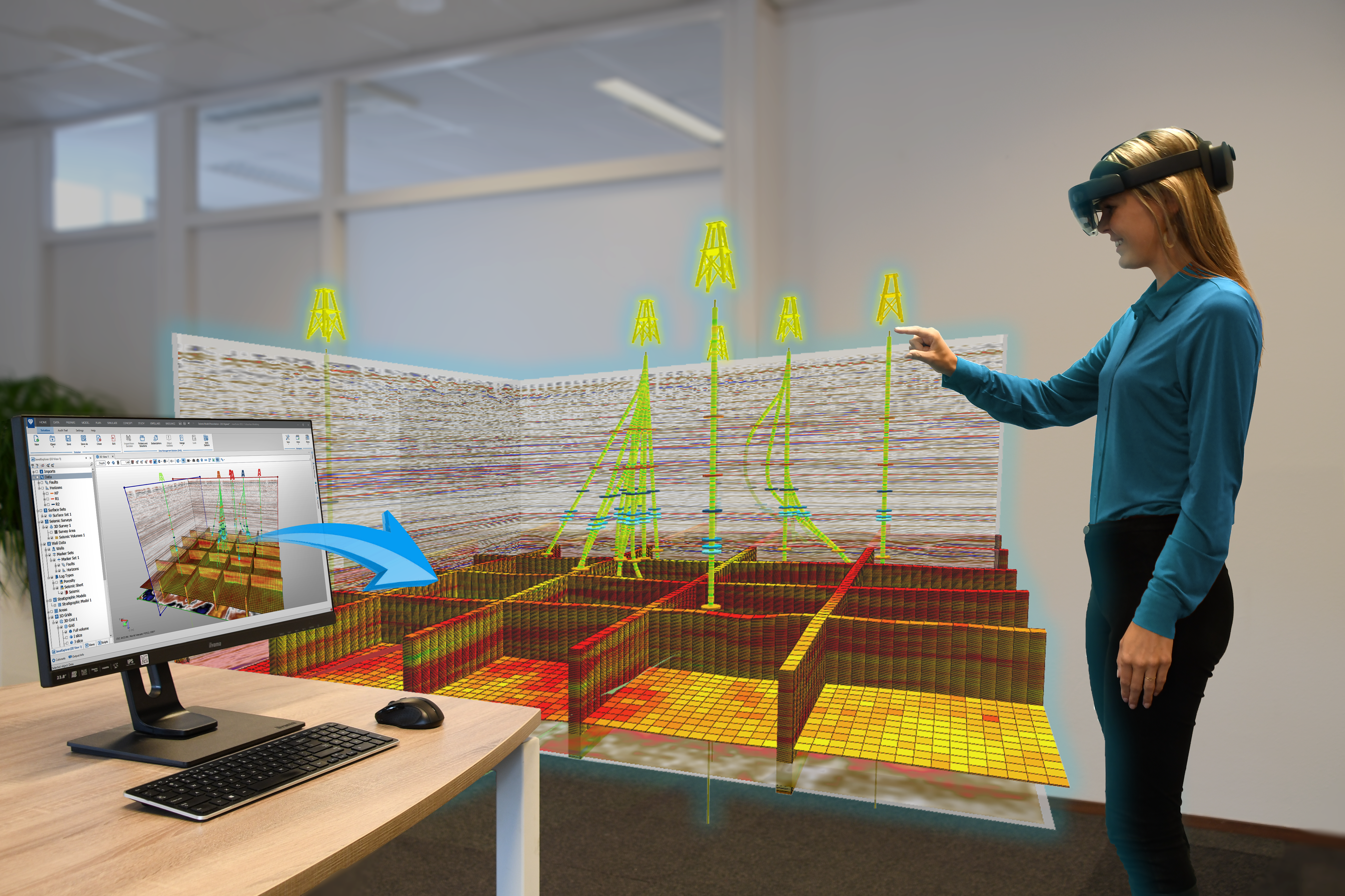 A user with a mixed reality headset views a 3D geological model at scale complimenting the PC workstation. (Source: BaselineZ)