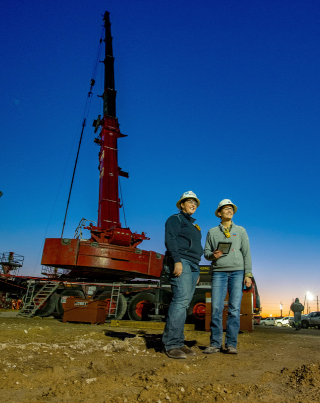 Chevron employees check on processes at a rig site. Pressure is on supermajors and independents alike to adhere to ESG-friendly operational standards. (Source: Chevron Corp.)
