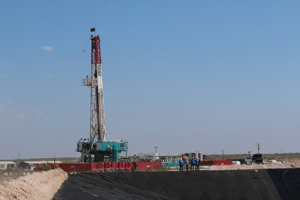 Hart Energy July 2022 - Hydraulic Fracturing Tech Book - AI Technology - AlphaX Sky - Image of rig at Lario Oil and Gas Midland Basin Field