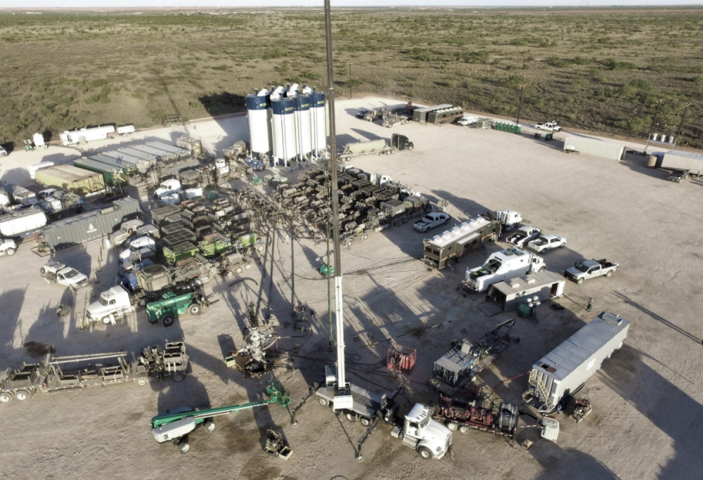 Hart Energy July 2022 - Hydraulic Fracturing Tech Book - AI Technology - AlphaX Sky - Lario Oil and Gas Midland Basin frack job aerial image