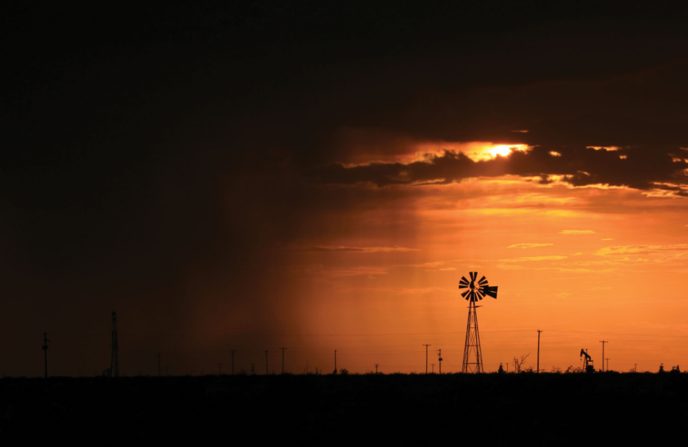 Oil and Gas Investor April 2022 The Permian Pursuit - Pumpjack at sunset image