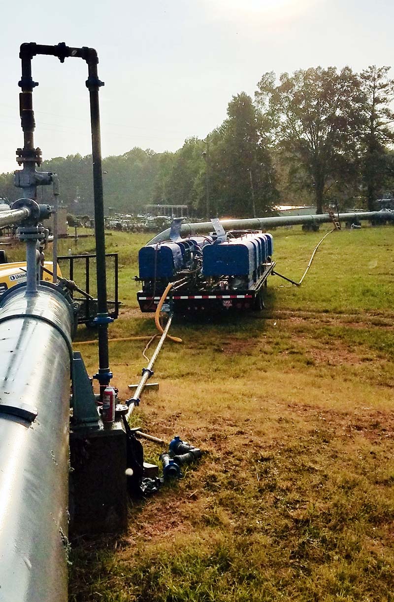 A repair team can safely fix leaks in a natural gas pipeline, like the one shown here, with help from Paxon Engineering & Infrastructure’s recompression equipment. The gas in this particular segment of the pipeline is removed and placed in a separate closed system (foreground). This keeps the gas from escaping into the atmosphere or needing to be burned off (flared). It also creates a safer environment for the repair crew because the gas is under control the entire time. When repairs are complete, the gas is returned to the pipeline. (Source: Paxon Engineering & Infrastructure Inc.)
