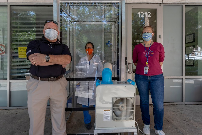 From left, Peter Donohue with Oceaneering and Naomi McCants and Mary Ellen McEvoy with Healthcare for the Homeless-Houston unveil a mobile COVID-19 testing facility designed to test members of Houston’s homeless community. (Source: Oceaneering)