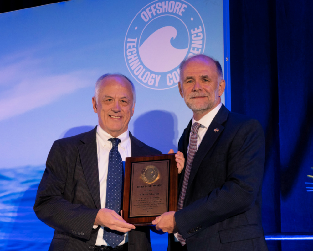 Roland Moreau receives OTC 2022 Heritage Award from OTC chairperson Paul Jones