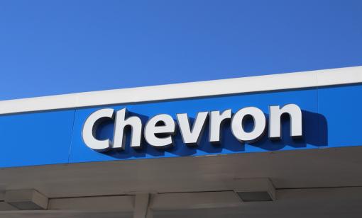 Image of Chevron's logo on a gas station.