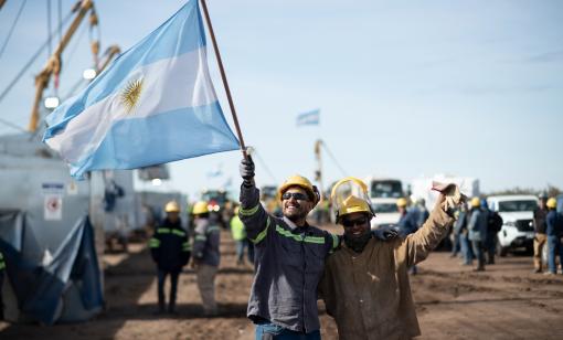 Argentine works wave the country’s flag