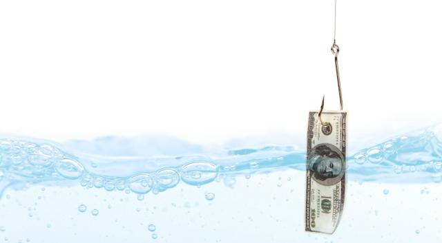 Fish hook underwater with dollar.