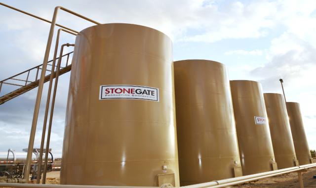Field tanks adorn one of Stonegate&#039;s Eagle Ford sites. (Source: Stonegate Production Co.)