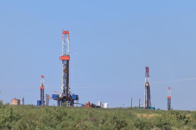 Multiple rigs are shown in the Permian Basin. (Source: GB Hart/Shutterstock.com)