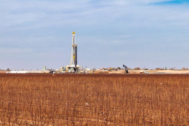 A drilling rig is shown in the Permian Basin in Texas. (Source: GB Hart/Shutterstock.com)