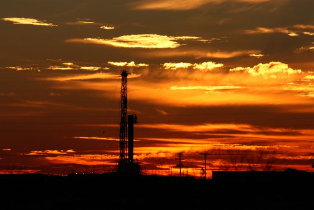 A Permian Basin rig is shown at sunset. (Source: GB Hart/Shutterstock.com)