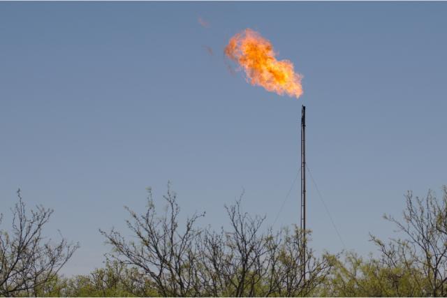 Excess natural gas is burned off at an oil well site in the Permian Basin. (Source: Sean Hannon/Shutterstock.com)