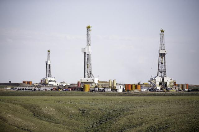Three hydro-fracking derricks