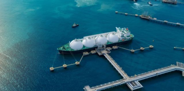 LNG tanker anchored at export terminal