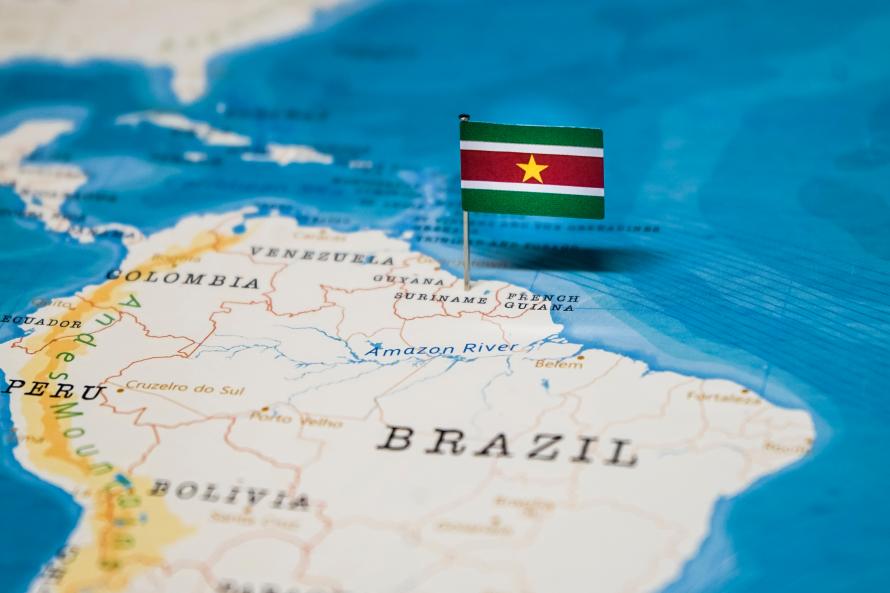 Suriname flag on a map of northern South America.