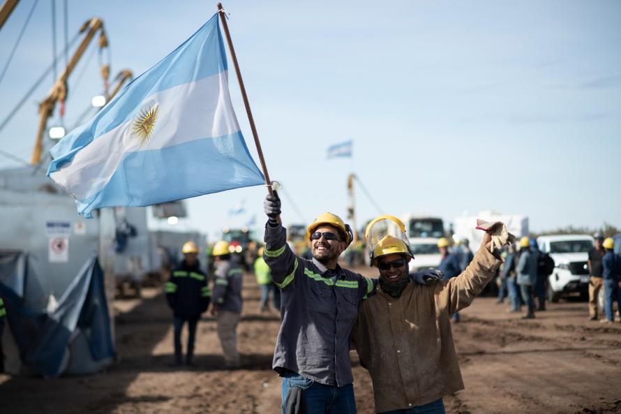 Argentine works wave the country’s flag