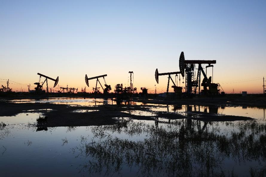 An oil field site in the evening